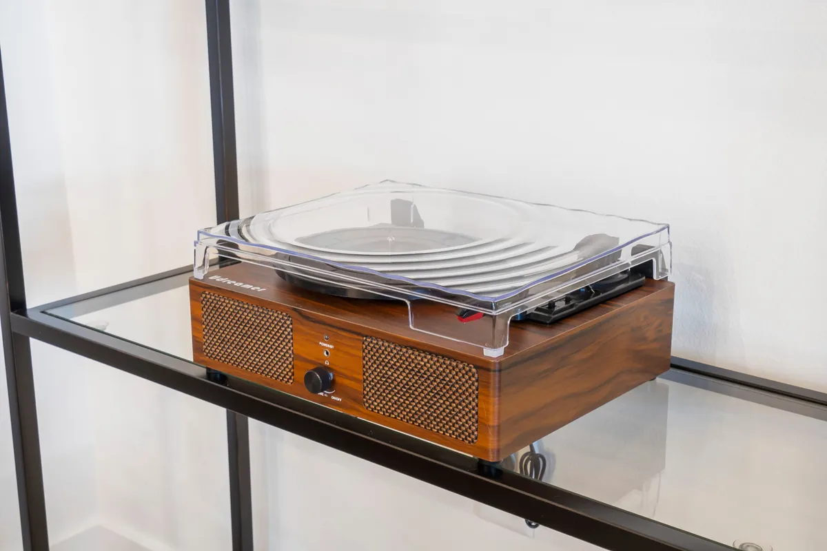 A stylish turntable set up for playing records, evoking a sense of nostalgia and relaxed entertainment. Perfect for adding a retro soundtrack to mornings or evenings spent together.